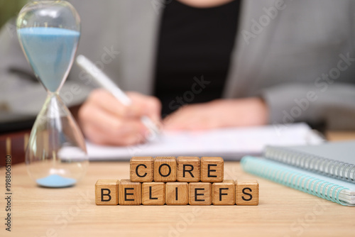 Принти на полотні A person engages in deep reflection and writing at their desk, focusing on core beliefs