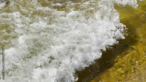 Wallpaper Mural Bright white bubbles and frothy foam crash over a shallow riverbed. The fast movement of the water creates an exciting and powerful feeling of pure natural energy. Torontodigital.ca