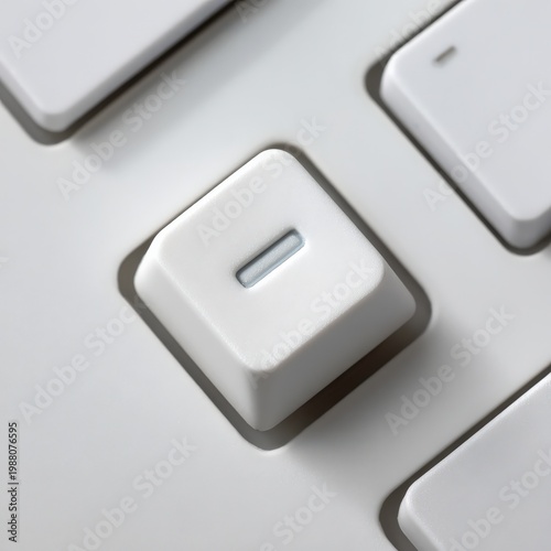 Close up of a white keyboard key highlighting minimalist design and functionality