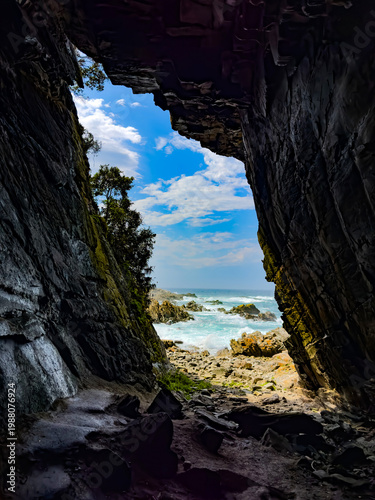 Scenic view of a coastal cave entrance