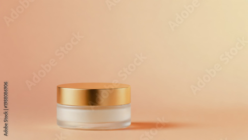 Small glass jar with gold lid and white cream isolated on peach background
