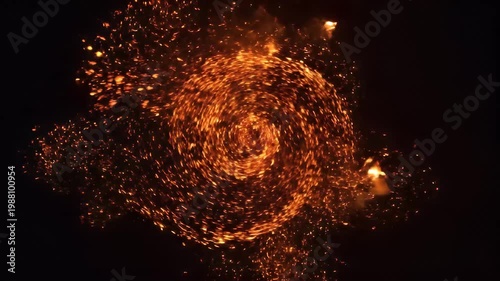 Dynamic swirling fiery orange sparks on an abstract black background