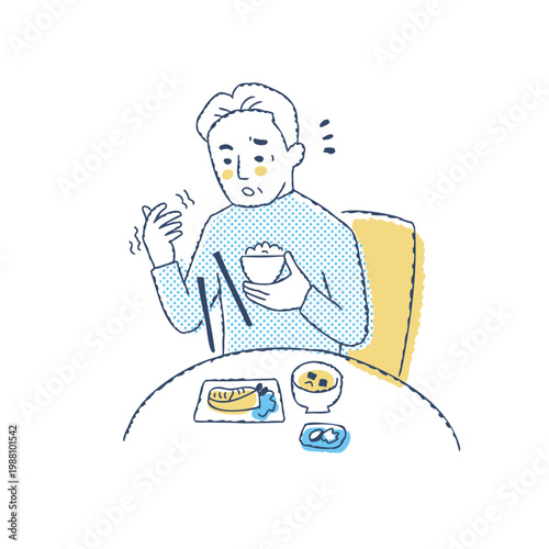 食事中に手から箸を落とすシニア男性