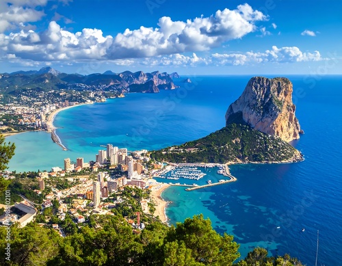 Aerial view of a coastal town with a large rock formation (2)