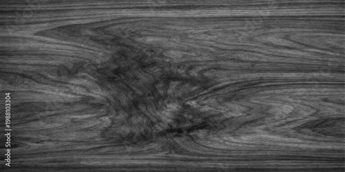 Dark wood texture and black grunge surface meet white chalk patterns in an abstract winter landscape of ocean waves and stone