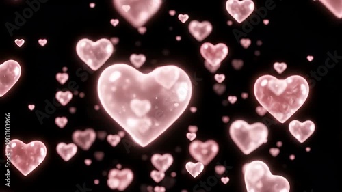 Floating pink glowing hearts on dark background with bokeh effect