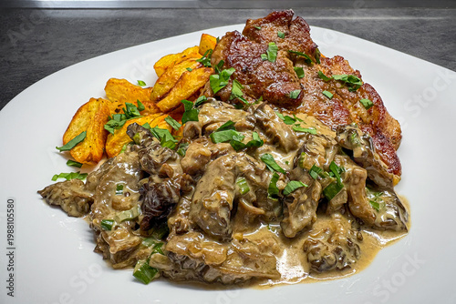 Morel mushroom in cream sauce with roasted meat and potatoes