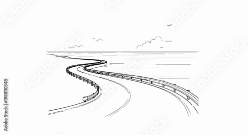 A winding road curves over water with guardrails under a cloudy sky