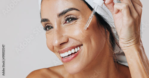 Canvas-taulu Skincare, thinking and woman with dropper in studio, hyaluronic acid treatment and anti aging serum