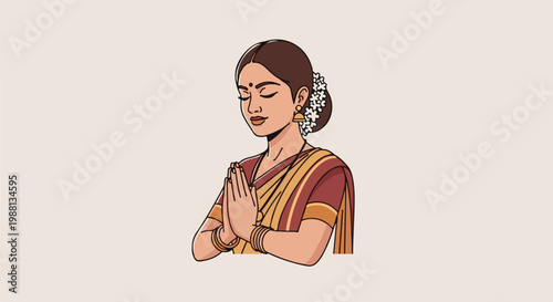 Woman in traditional attire with hands pressed together in greeting