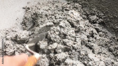 Mixing together to make a strong concrete floor, Mixing concrete concept, Slow motion
