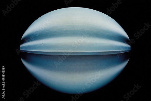 Futuristic blue sphere with moire pattern and reflection on black background