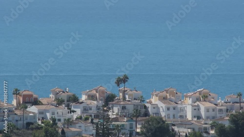 Coastal view showing a town near the sea during a clear day