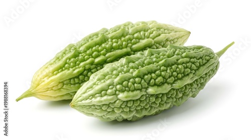 Two green bitter melons on white surface  healthy food and vegetable  momordica charantia