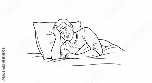 Man lying in bed, holding his head in distress, possibly ill or worried