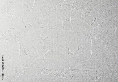 A close-up view of rough white plaster, showing fine grain texture and subtle imperfections perfect for backgrounds or architectural context, irregular, structure, rough