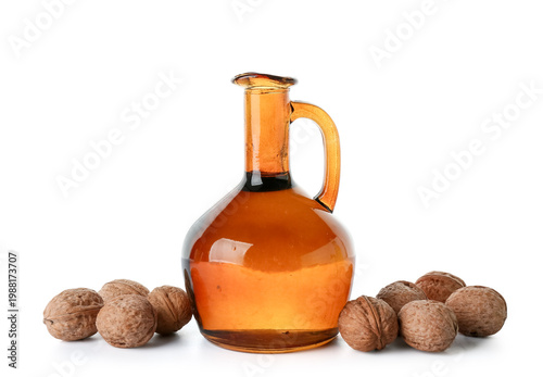 Tasty walnuts and jug of oi...