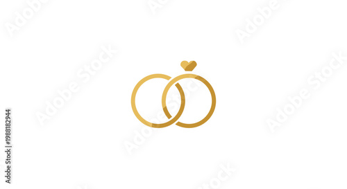 Two interlocking gold wedding rings featuring a small heart shaped diamond setting on one band are centered against a minimalist white background backdrop.