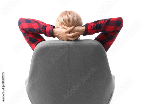 Foto Young man in rocking armchair on white background, back view