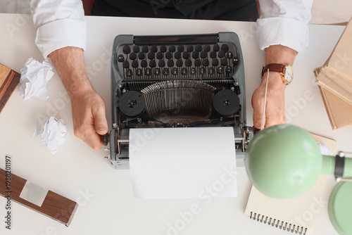 Young male writer with vint...