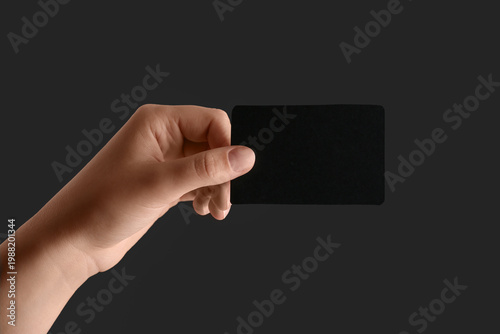 Female hand with blank blac...