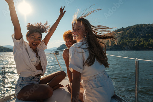 Obraz na plátně Happy friends enjoying summer vacation sailing on boat