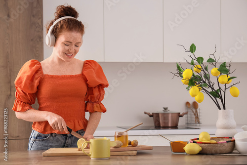 Young redhead woman with he...