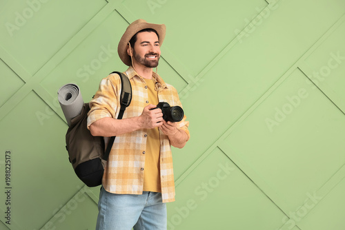 Young male tourist with bac...