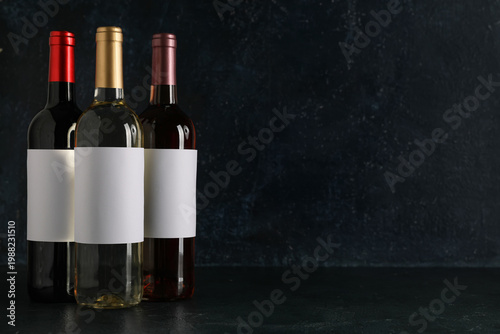 Three assorted wine bottles...