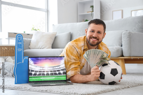 Happy young man with soccer...