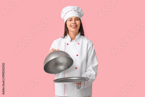 Female chef with silver tra...