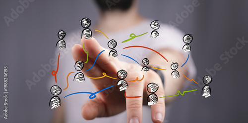 Hand pointing at network of...