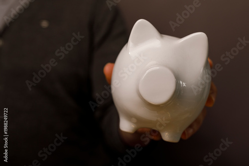 Person holding a white pigg...