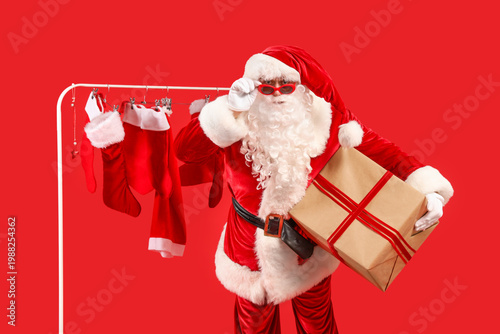 Santa Claus holding gift bo...