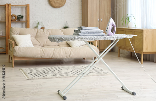 Iron and stack of bed sheet...