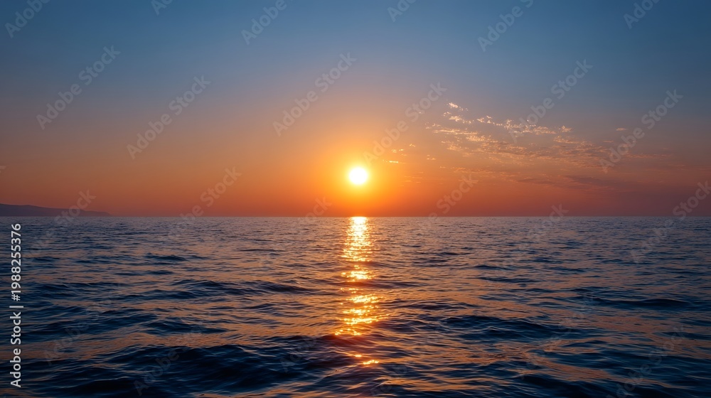 Obraz premium Vibrant sunrise illuminating the calm ocean surface stretching across the vast and peaceful horizon