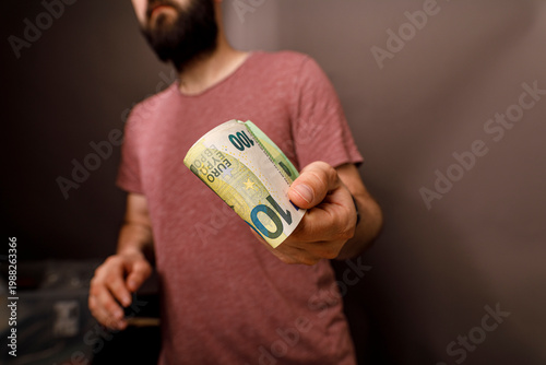 Close up of a man holding o...