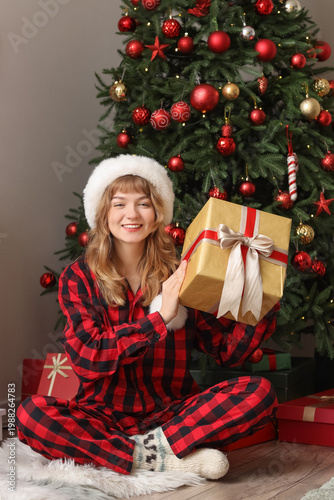 Pretty young woman in Santa...