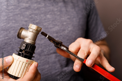Close up of a handyman usin...