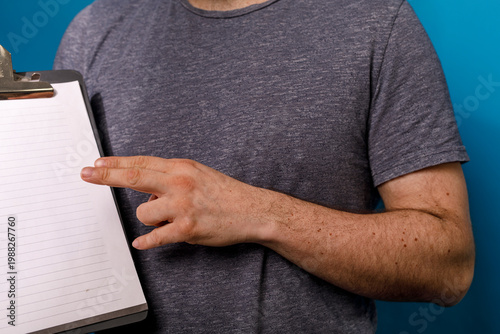 Close up of a man holding a...