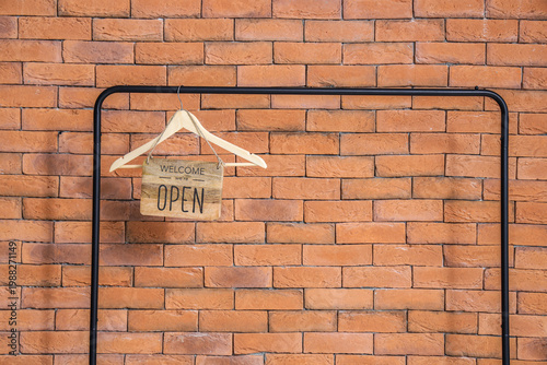 Wooden sign with text WE'RE...