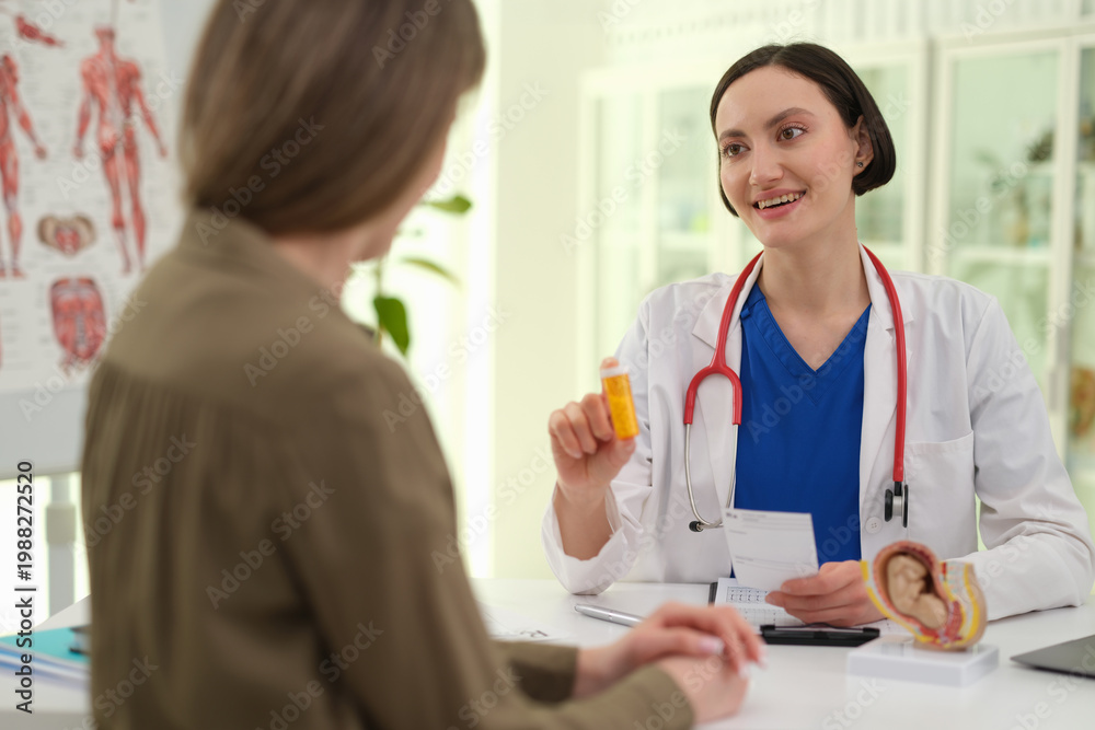 Fototapeta premium A healthcare professional engages with a patient in a well-lit clinic, discussing medication and treatment options. The atmosphere is welcoming, fostering trust and communication.