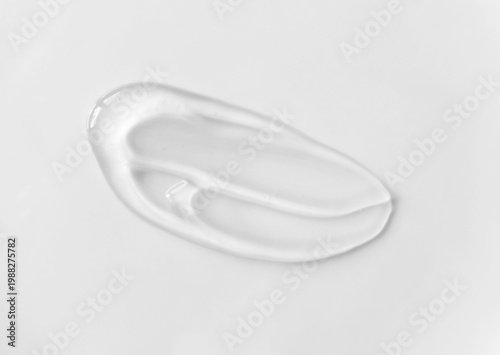 Transparent cosmetic gel smear texture isolated close-up.  Skincare with hyaluronic acid stroke sample modern and minimal