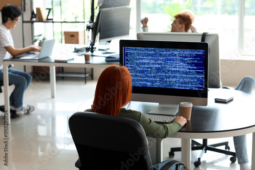 Female programmer working i...