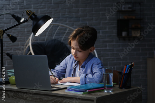 Little boy doing homework w...