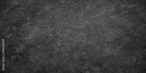 A closeup of a dark grunge black leather and fabric material texture with a rough gray stone pattern surface for a blank wallpaper backdrop