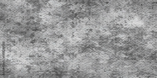 A rough grunge texture of old gray cement and marble pattern provides a dirty stone surface for a blank concrete wall backdrop