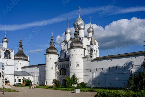 The entrance to the medieval monastery in the fortress wall with towers and domes of the church in Rostov the Great