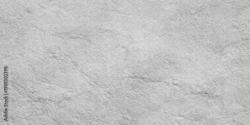 A blank white paper and marble texture background with a rough stone pattern and gray concrete surface creates a grunge material design backdrop