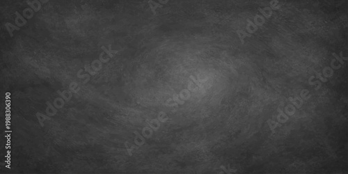A dark vintage blackboard surface features a grungy black chalkboard texture with a blank gray stone wall pattern and old dirty concrete design for a textured frame backdrop